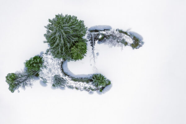 island in a small frozen lake -