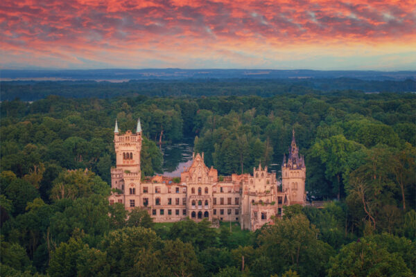 ..a burnt-out castle in Poland that has been decaying for decades. -