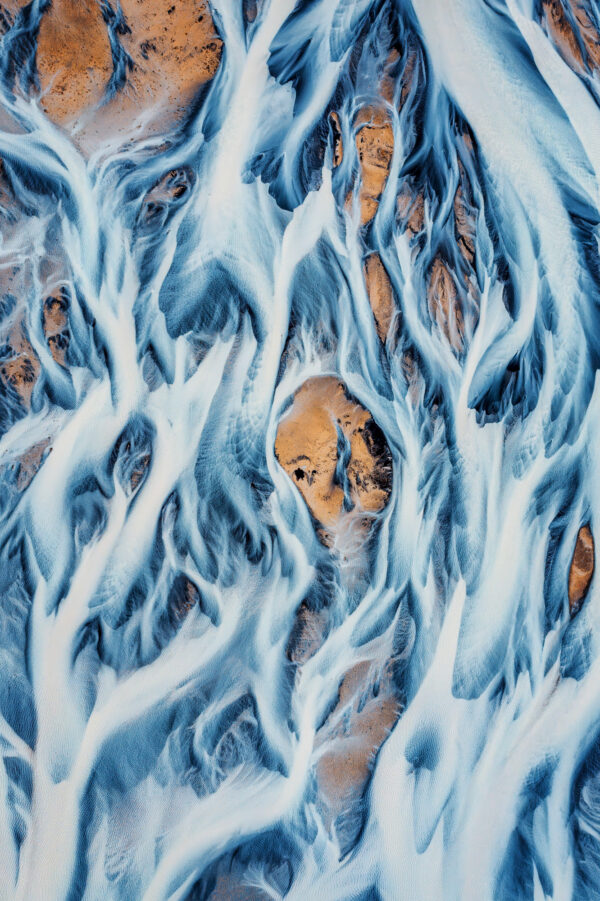 a glacial river in Iceland from above. If I look longer I see a face in the burning pyre -