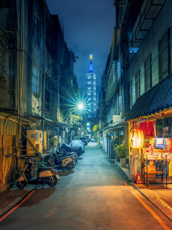 view through a small street to the Taipei 101 skyscraper -