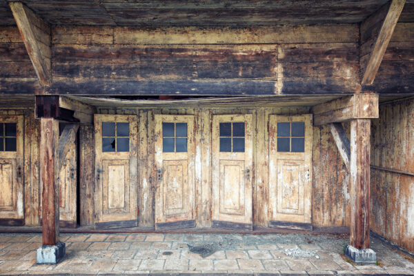 changing cubicles in an abandoned indoor swimming pool -