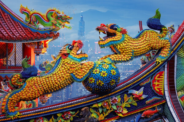 ..dragon figures appear frozen in mid-play with a ball, overlooking the skyline of Taipei. In the distance, the iconic Taipei 101 rises through the mist, bridging ancient myth with urban reality. -