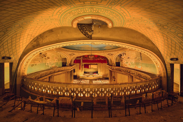 a abandoned Theatre, light setting only with candlelights -