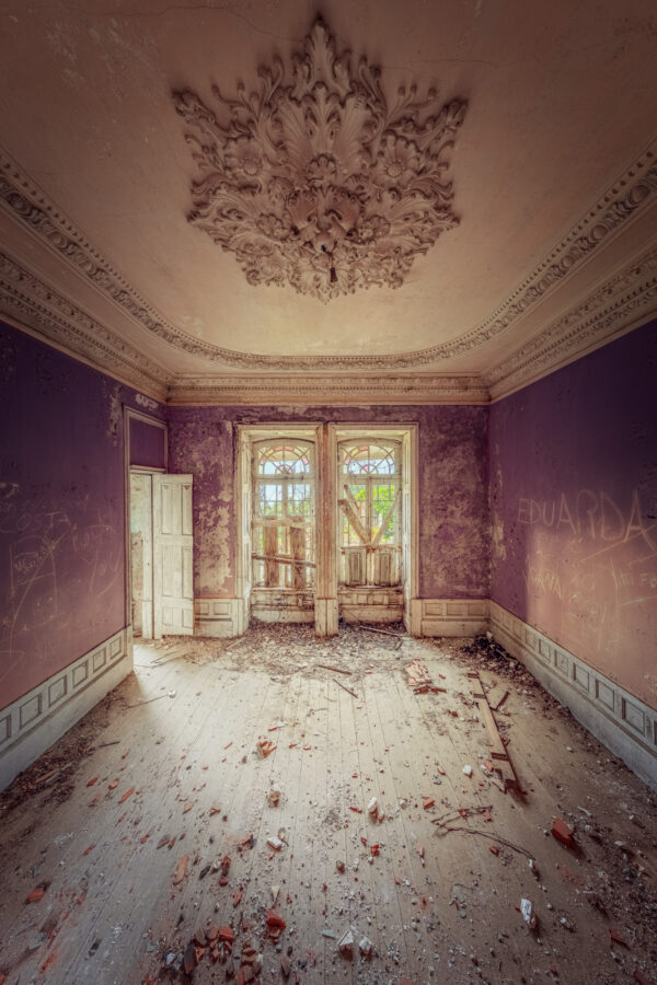 room with impressive ceiling stucco in an abandoned palace -
