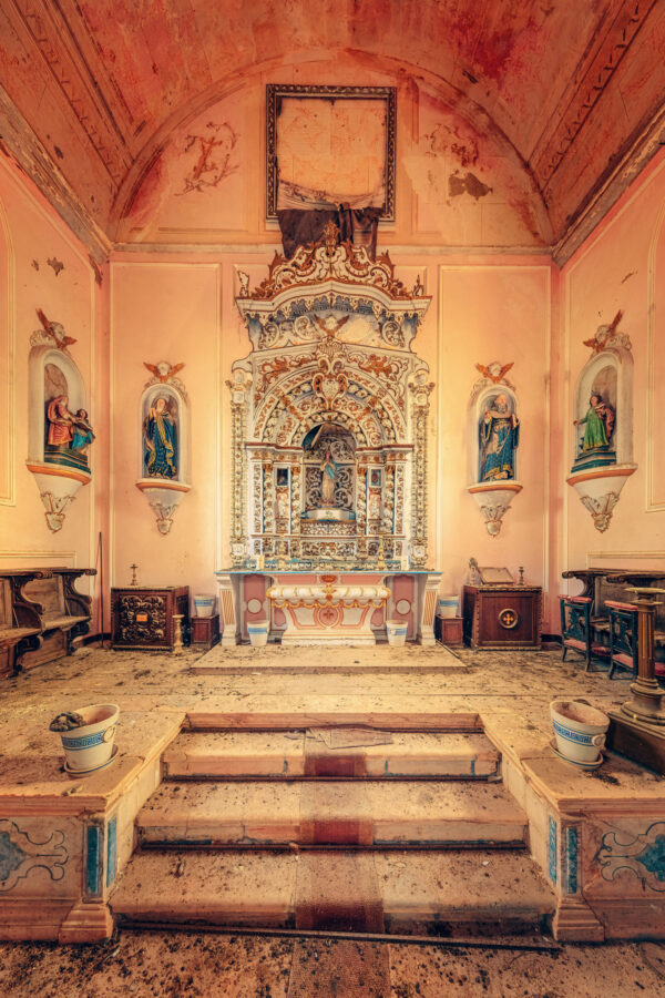 The altar of an abandoned church in Western Europe. The church grounds are now used for sheep grazing. -
