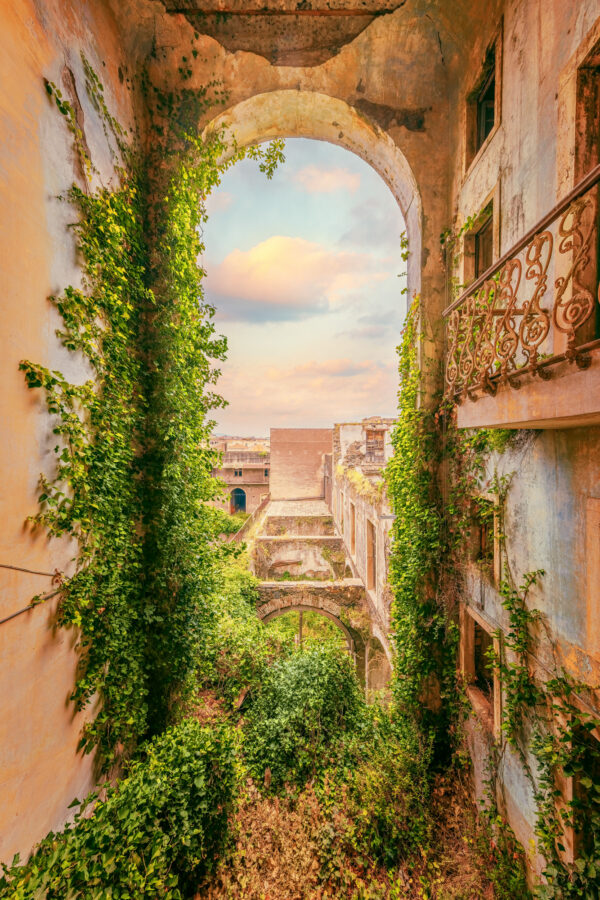 a large and impressive arch in an abandoned factory -