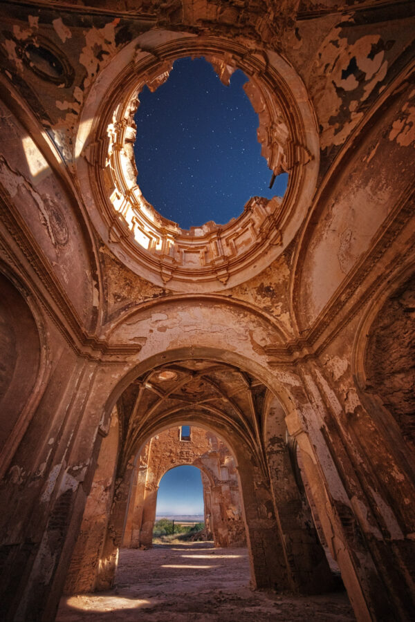 night shot of an abandoned, destroyed church -